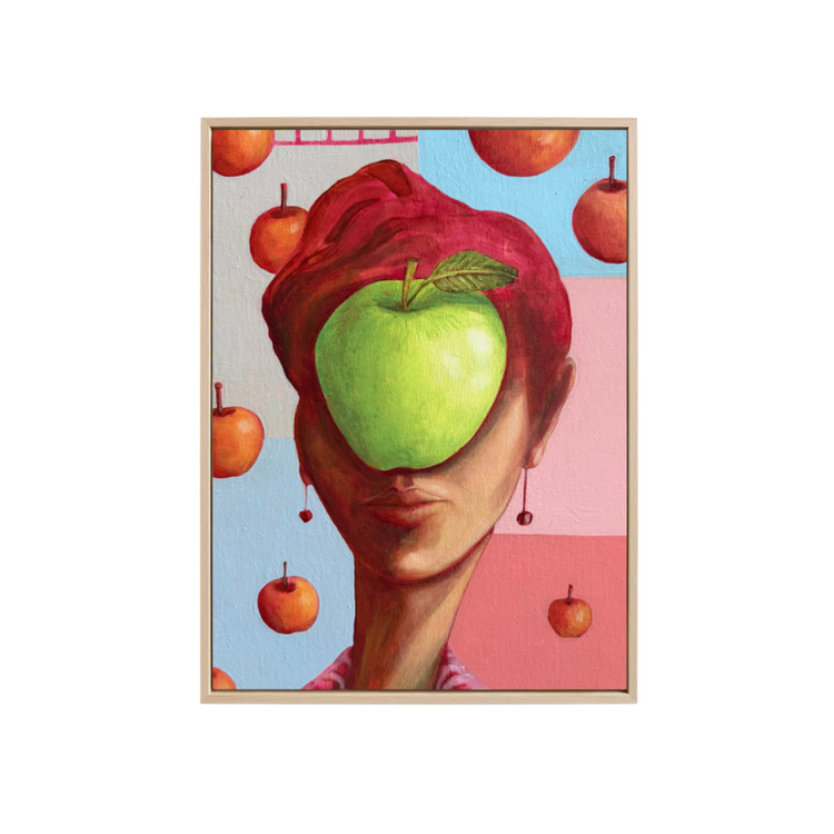 A surreal art print featuring a woman with red hair whose face is obscured by a green apple, surrounded by floating red apples against a split light blue and pink background.