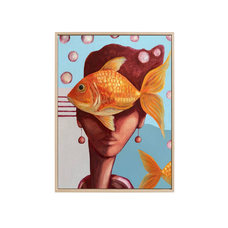 A surreal art print or painting featuring a large orange-gold fish over a stylized face with dark hair, set against a light blue background with pink bubbles. The artwork is shown centered on a plain white background.