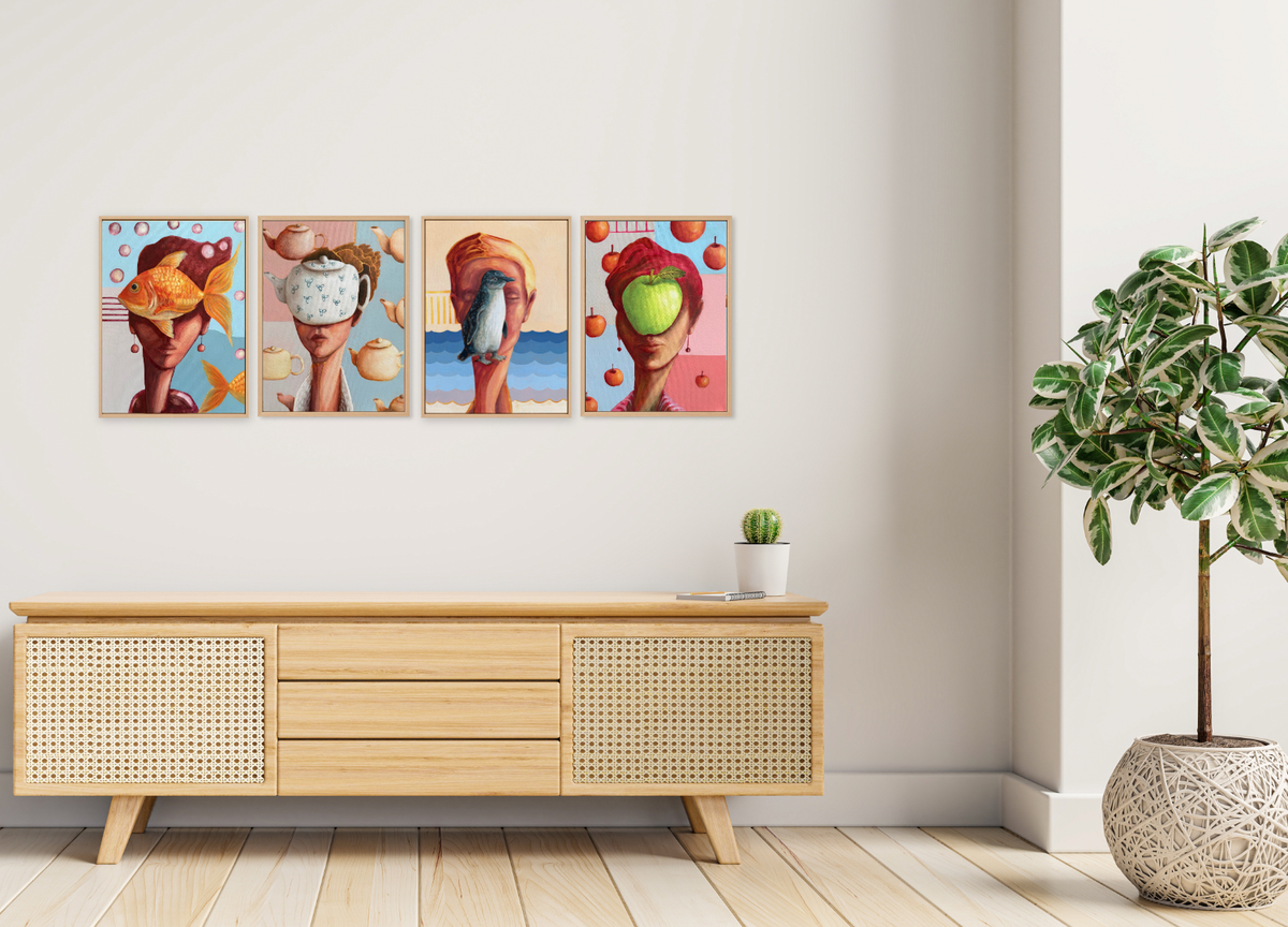 A 4-panel canvas wall art set featuring colorful surreal art prints of hands holding various objects, displayed on a white wall above a light wood sideboard in a modern living room setting.